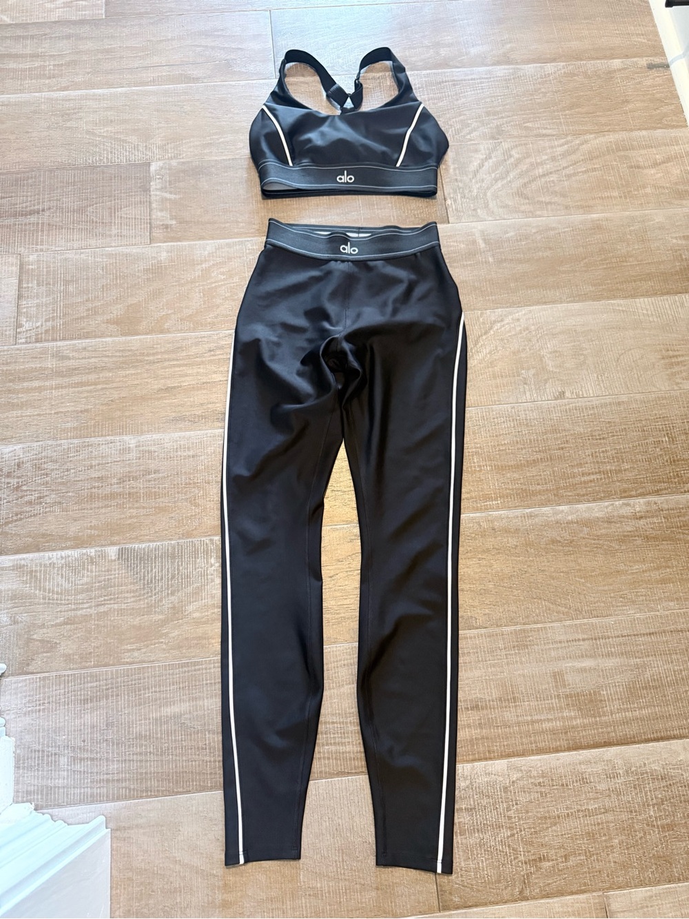 ALO Yoga Black Leggings with White Side Stripe and matching sports bra